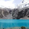 view of Laguna 69 and snow capped peaks on the background